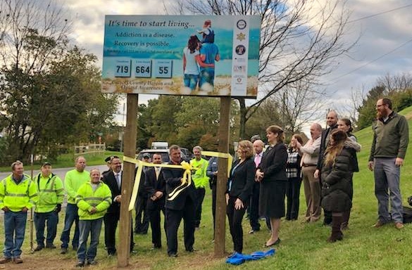 Local officials cut ribbon on new opioid awareness sign