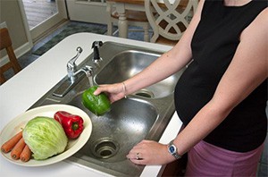 Pregnant woman preparing dinner