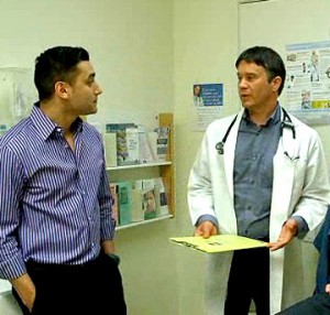 Patient being assessed by his doctor