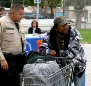 Police officer speaking to a homeless man