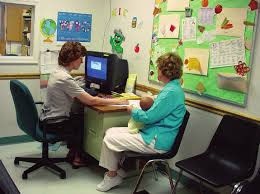 Employee helping a patient